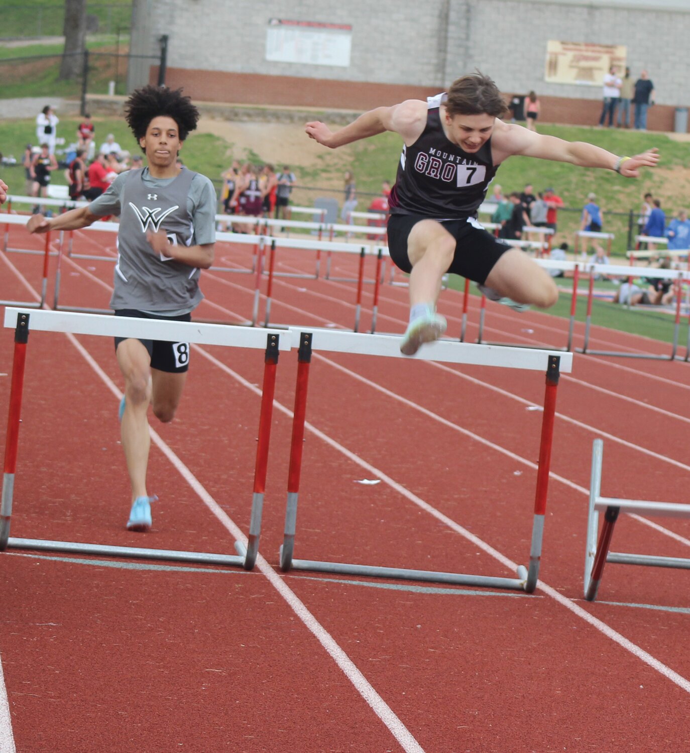 Mountain Grove’s Alexander Prestage clears the final hurdle in the 300-meter hurdles race.